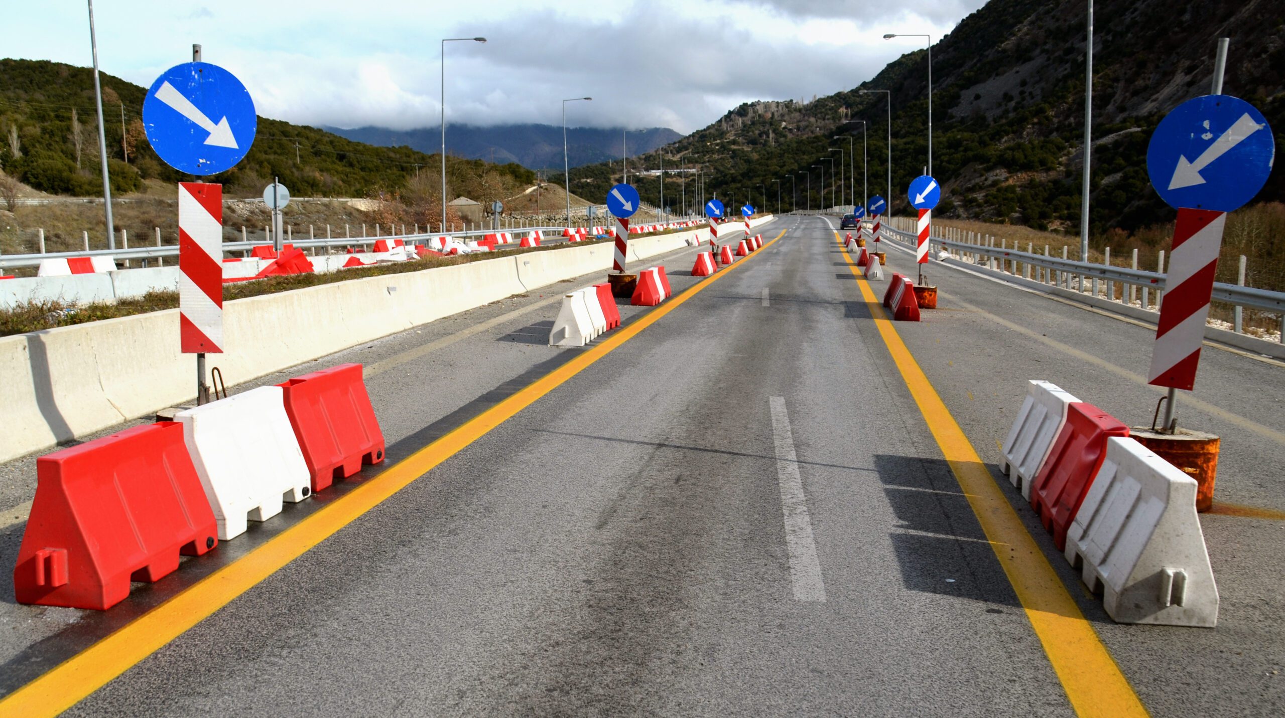 a road with cones on it.